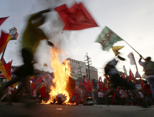 Protesters during May Day Wednesday, May 1, 2013 in Manila, Philippines. AP / Bullit Marquez