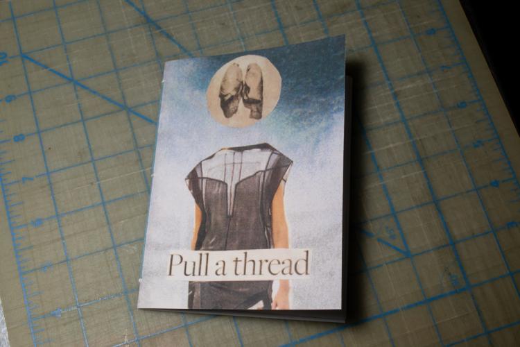 Behind the scenes: Pull a Thread. The first finished copy of Pull a Thread with a collage of a girl with lungs for her head on the front.