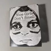 The cover of Nice Girls Don't Smell which has a black and white face with the title.