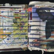 Connections: Random Journal Page 187 by Laura Chenault is a collage with a map of Oakland on the left and an image of a man holding something unidentified on the right. Stripes across the man continue into the grid lines on the map.