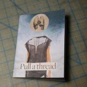 Behind the scenes: Pull a Thread. The first finished copy of Pull a Thread with a collage of a girl with lungs for her head on the front.